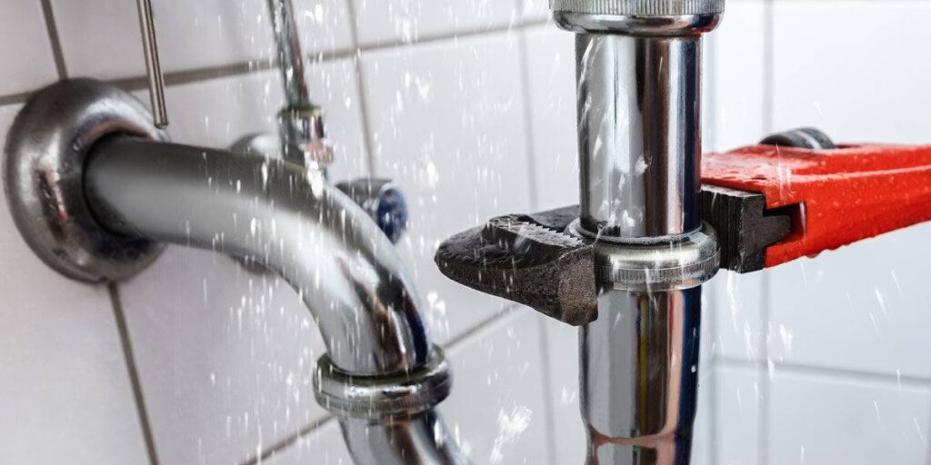 all-ways-drains-pipe-repair | All Ways Drains plumbing company at work tightening pipe with wrench