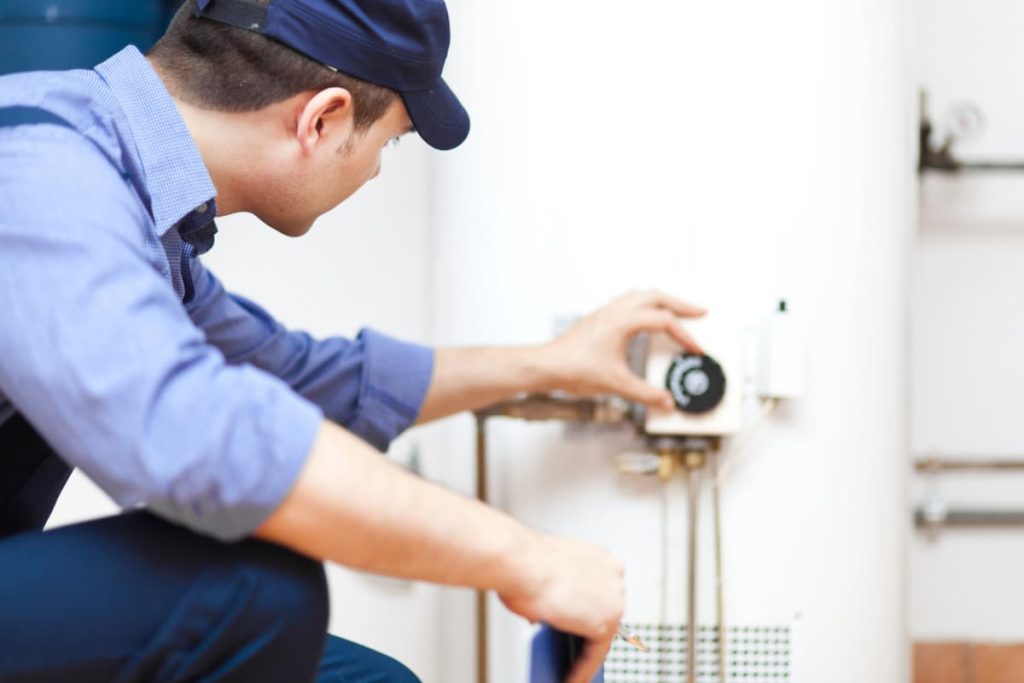| All Ways Drains plumber performing water heater repair